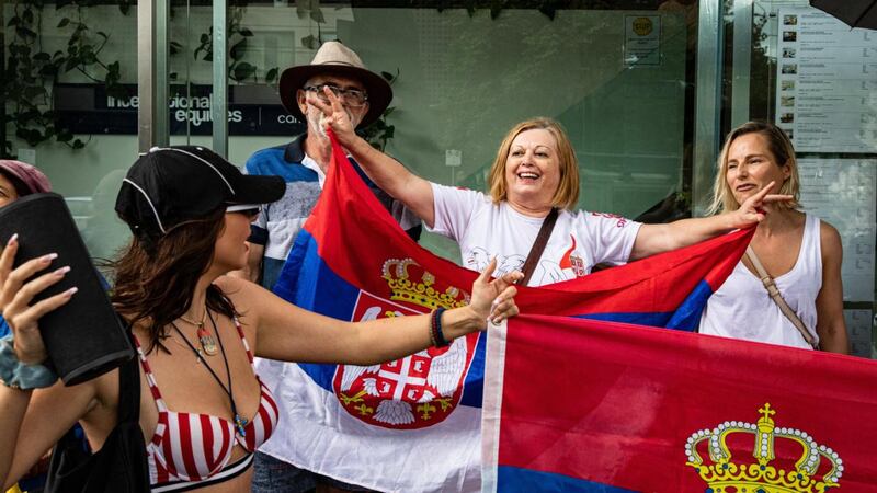 Supporters gather outside Park Hotel inMelbourne where Novak Djokovic was taken pending his removal from the country after his visa was cancelled by the Australian Border Force. Photograph: Diego Fedele/Getty