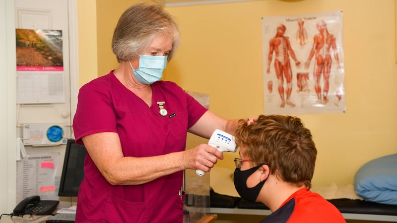 Villiers School nurse Beverley Callender with third-year student Luke McNamara.  Photograph: Diarmuid Greene