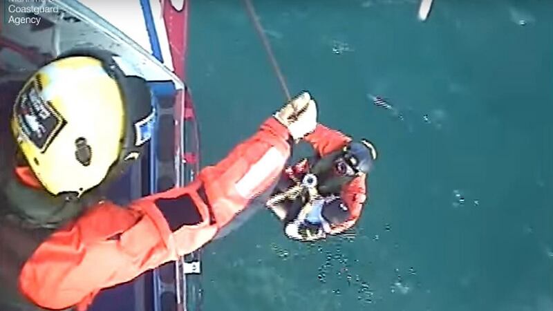 Coastguard crew rescuing Matthew Bryce. Photograph: PA