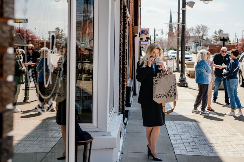 Angela Boelens, founder of IA Nice, talks on her phone in DeWitt, Iowa. Photograph: Jamie Kelter Davis/The New York Times