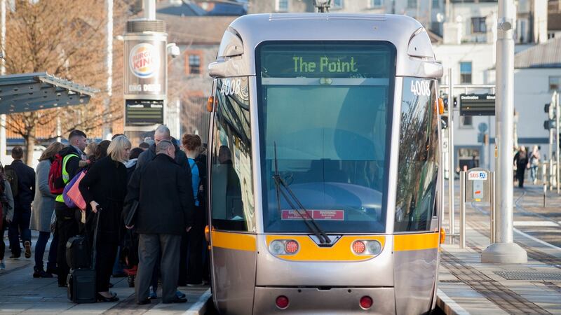 Commuters waiting board a Luas tram following secondary picketing linked to the Bus Éireann strike at Heuston Station, Dublin. Photograph: Gareth Chaney/Collins