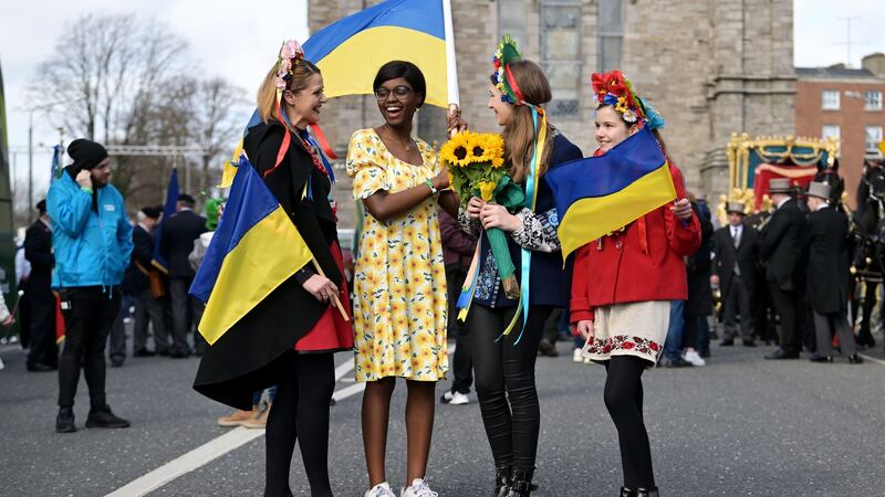Rachael Diyaolu (second left), an Irish student who had been studying in Ukraine and fled home after the war began,with members of the local Ukrainian community in Dublin in March. Photograph: Charles McQuillan/Getty Images