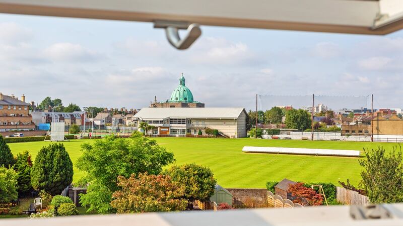 The converted attic guest room has views across Leinster Cricket Club Grounds