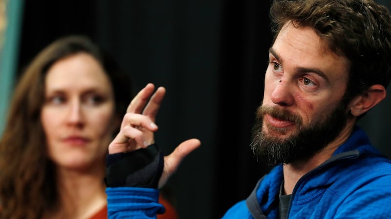 Travis Kauffman urged other runners not to listen to music while running because if he had been wearing them he might not have heard the pine needles rustle behind him, which alerted him to the mountain lion. Kaufman’s girlfriend, Annie Bierbower, looks on. Photograph: David Zalubowski/AP