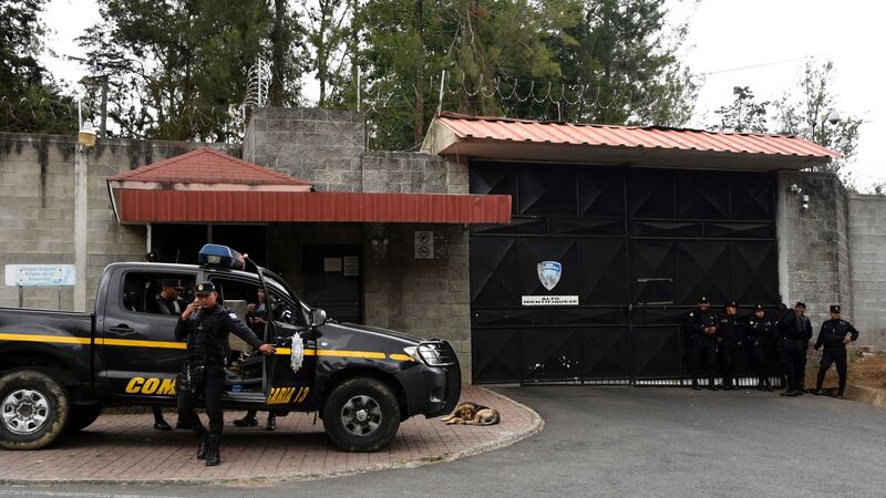 Police guard the entrance of Virgen de la Asuncion children’s shelter after the March 2017 fire. Photograph: Johan Ordonez/AFP/Getty Images