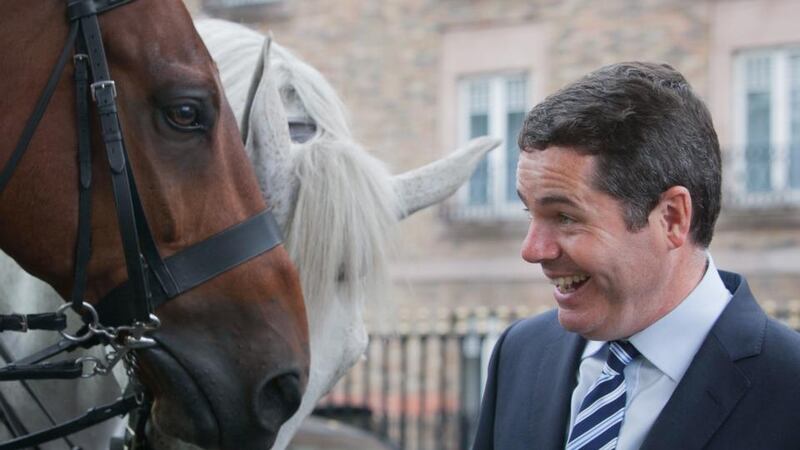 Mounted Garda horses Donagh and Oscar with Minister for Transport, Tourism and Sport,  Paschal Donohoe,  at the launch of the RSA and Horse Sport Ireland booklet, Horse Road Safety on Public Roads, on Simmonscourt Road, Dublin. Photograph: Gareth Chaney/Collins