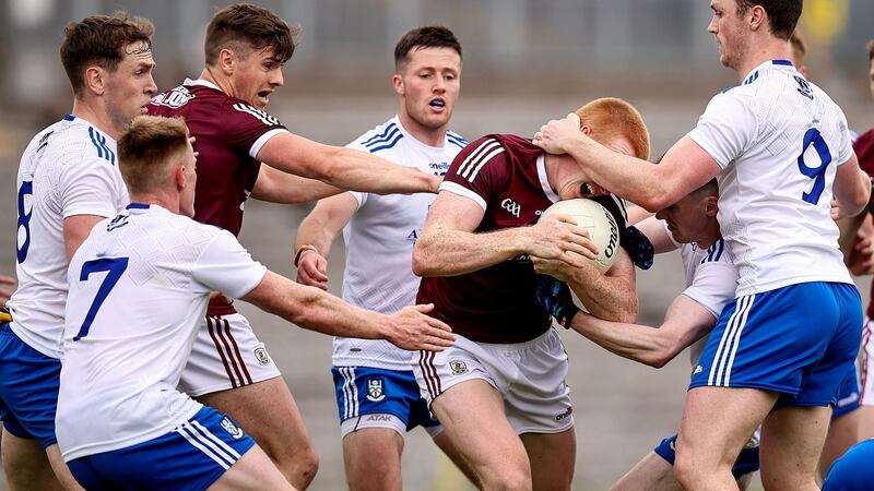 Monaghan’s Killian Lavelle tackles Peadar O Cuaig of Galway. Photo: Tommy Dickson/Inpho