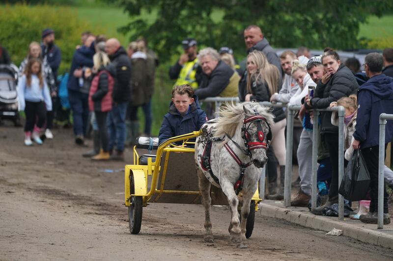 A person in a horse-drawn carriage during the Appleby Horse Fair. Photograph: Owen Humphreys/PA