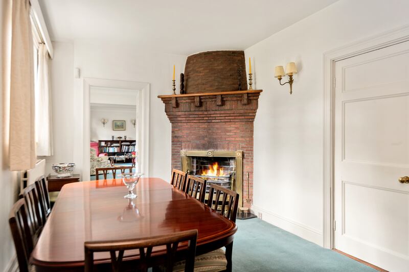 The dining room has an interesting corner fireplace