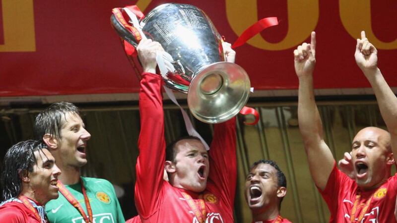 Rooney lifts the Champions League trophy afer winning it in 2008. Photo: Matthew Peters/Manchester United via Getty Images