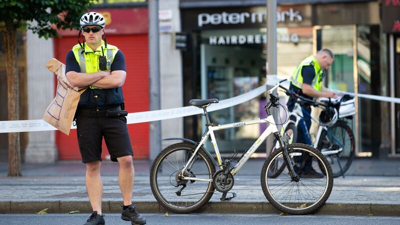 A garda at scene of the fatal stabbing on O’Connell Street in  Dublin. Photograph: Tom Honan/The Irish Times.