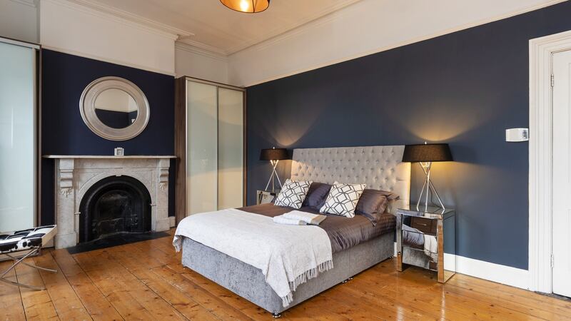 The principal bedroom, which is the width of the house and has a open fireplace