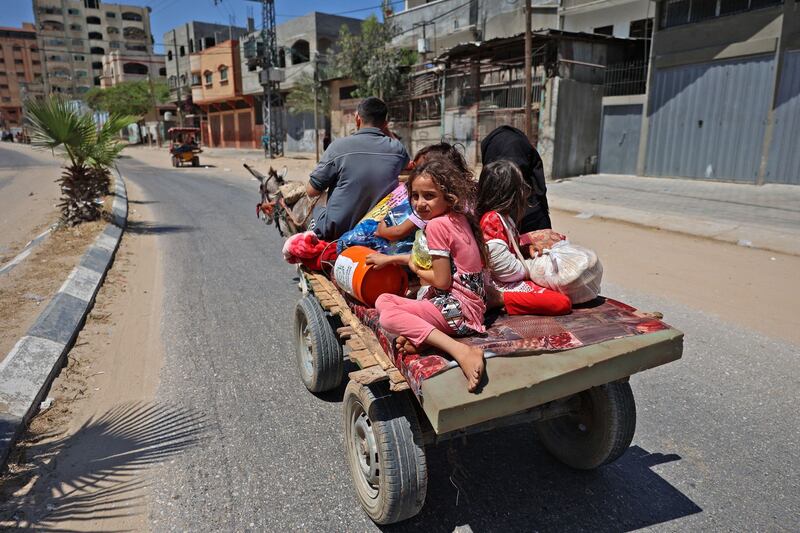Members of a Palestinian family flee Israeli air strikes on a carriage pulled by a donkey in Beit Lahya in the northern Gaza Strip. Photograph: Mohammed Abed/AFP via Getty