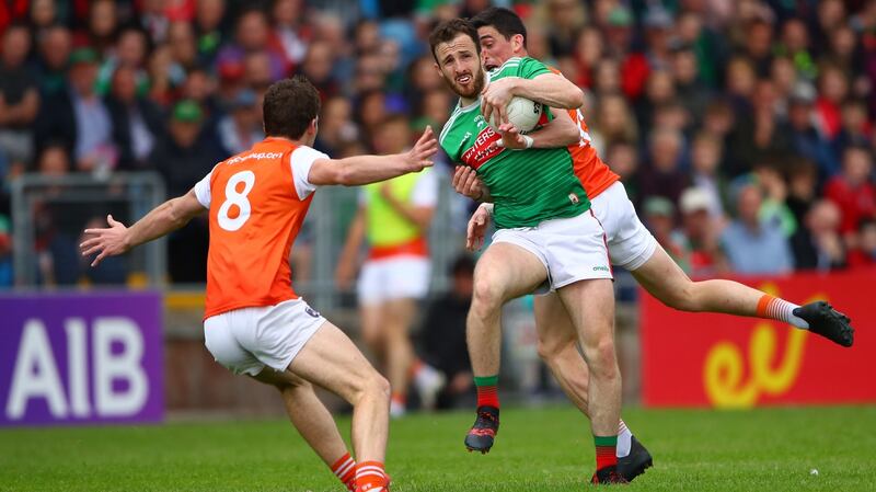 Armagh’s Jarlath Og Burns and Rory Grugan battle against Darren Coen of Mayo. Photograph: James Crombie/Inpho