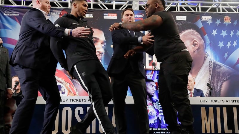 British boxer Anthony Joshua, left, is shoved by Jarrell Miller, right, as they pose for photographs during a news conference in New York to promote their upcoming fight. Photo: Frank Franklin II/AP Photo