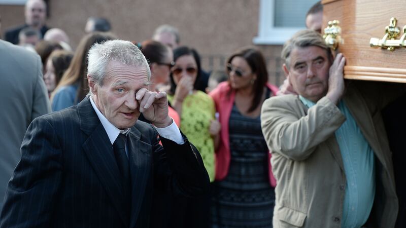 One of the Birmingham Six, Paddy Hill, wipes a tear as the coffin of Gerry Conlon is carried into St Peter’s Cathedral, Belfast,  for a requiem mass on June 28th, 2014. Photograph: Charles McQuillan/Getty Images