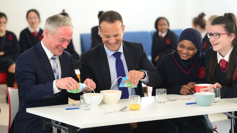 Ministers Richard Bruton and Leo Varadkar  with students at the announcement of  expansion of the  School Meals Scheme 2017. Bruton said 79 schools were to be added into the Deis programme. Photograph: Dara Mac Dónaill