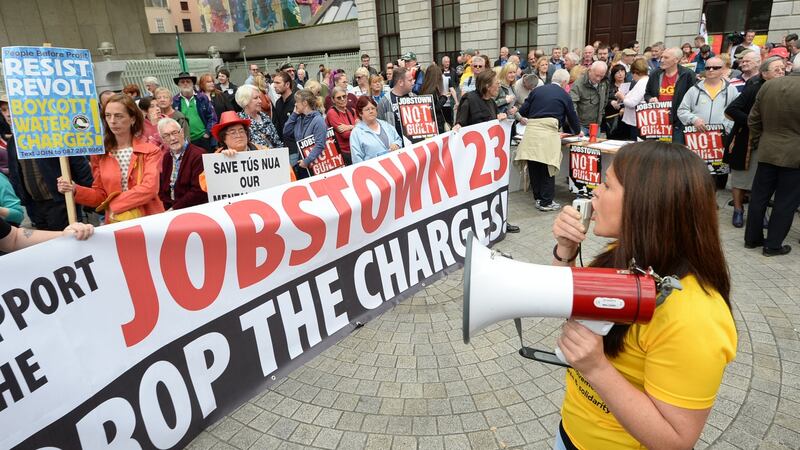 Protesters outside the Central Bank in Dublin during a Jobstown Not Guilty protest, in  support of  those accused of falsely imprisoning  then-tánaiste Joan Burton during a 2014 water charges rally. File photograph: Dara Mac Dónaill/The Irish Times