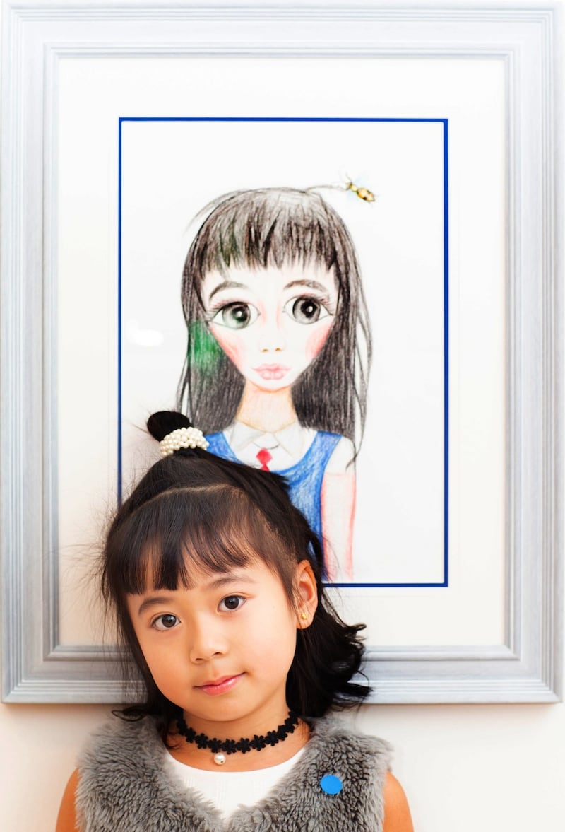 Zurich Young Portrait Prize contestant Rita Ruitong Chen (6) with her painting called School Girl. Photograph: Tom Honan/The Irish Times.