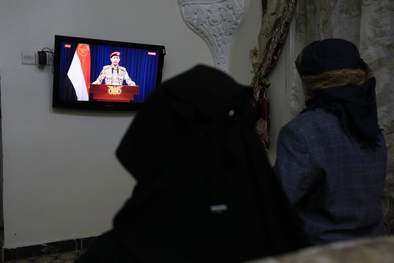 People in Sanaa, Yemen, watch Houthi military spokesman Yahya Sarea make a statement following the group's latest shipping attack in the Gulf of Aden. Photograph: Yahya Arhab/EPA