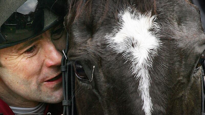 Conor O’Dwyer with War of Attrition after winning the 2006 Cheltenham Gold Cup. Photograph: Getty Images