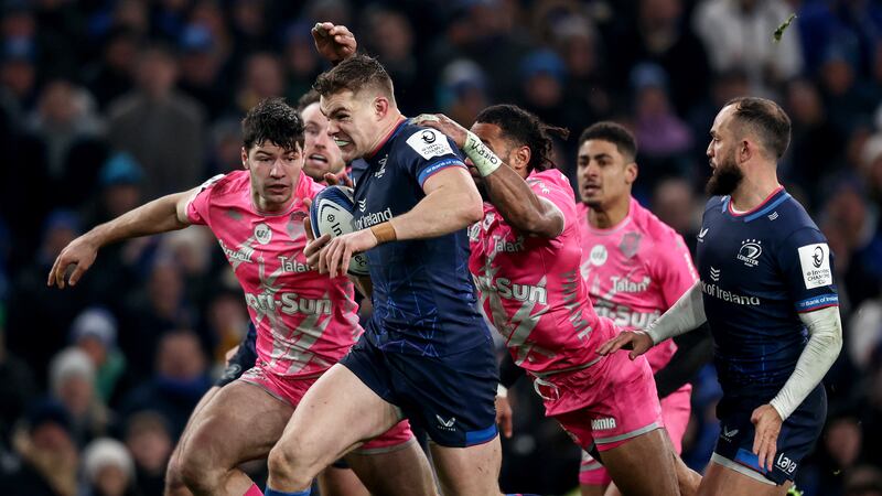 Leinster's Garry Ringrose is tackled by Stade Francais' Paris Stephane Ahmed and Peniasi Dakuwaqa during the game at the Aviva Stadium. Photograph: Ben Brady/Inpho