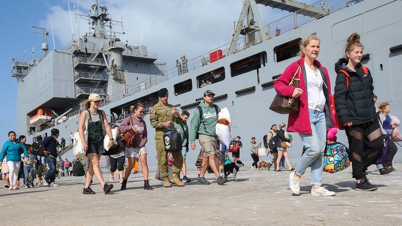 Evacuees from Mallacoota arrive on the navy ship HMAS Choules at the port of Hastings, Victoria, Australia, on Saturday. Photograph: Ian Currie/AAP/Reuters