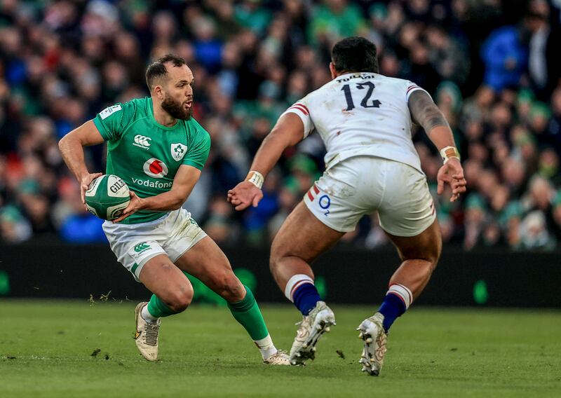 Ireland’s Jamison Gibson-Park in action against Manu Tuilagi of England. Photograph: Dan Sheridan/Inpho