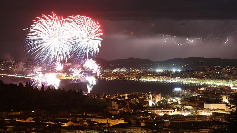 A flash of lightning is seen as fireworks explode over Nice on  Bastille Day. Photograph: AFP/Getty Images