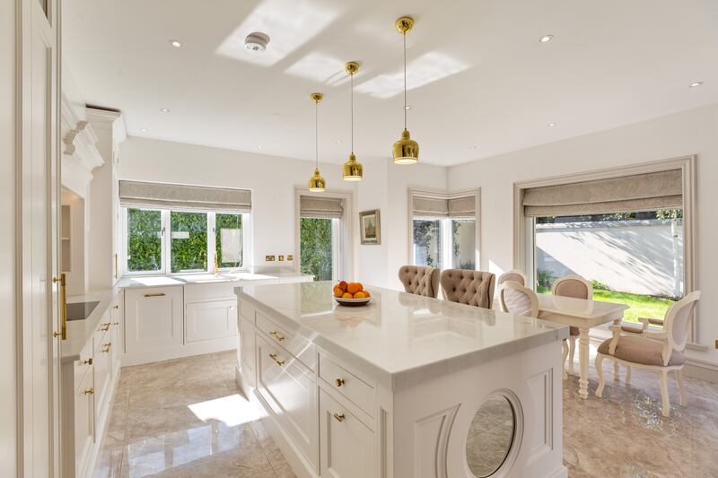 An all white kitchen helps bounce light internally 