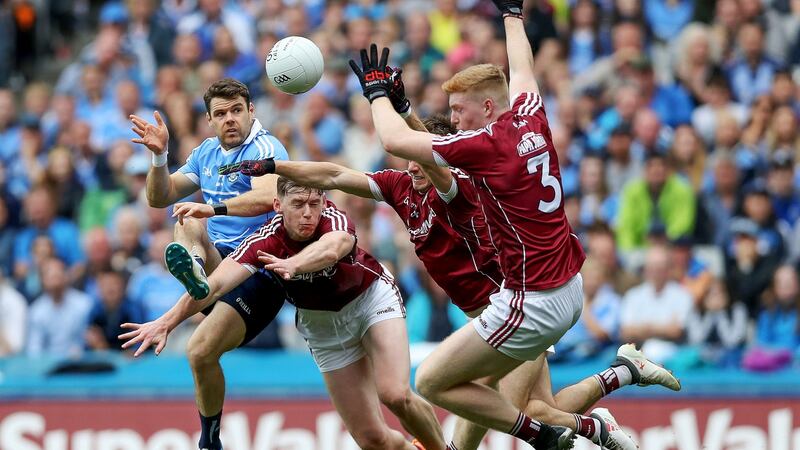 Dublin’s Kevin McManamon is charged down by Thomas Flynn, Eoghan Kerin and Seán Andy Ó Ceallaigh of Galway during the 2018 All-Ireland semi-final at Croke Park. Photograph: Tommy Dickson/Inpho