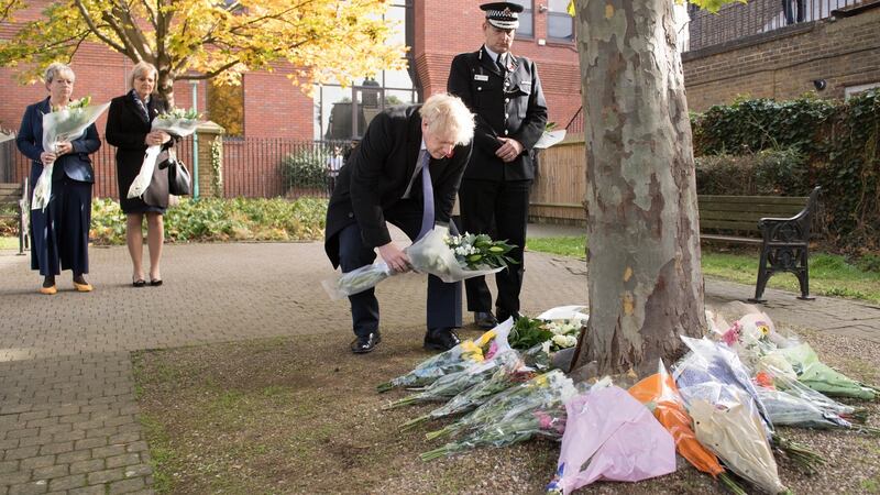 Boris Johnson  lays flowers during a visit to Thurrock Council Offices on Monday.  Photograph: Getty