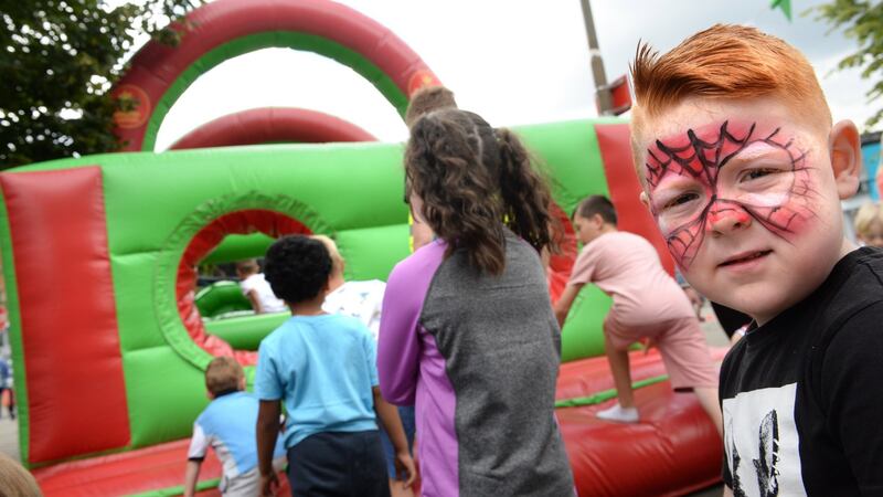 Logan Grimes queues for the bouncy castle at Hope Fest. Photograph: Dara Mac Dónaill