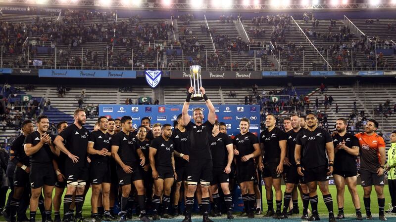 New Zealand’s captain Kieran Reid lifts up Rugby Championship trophy. Photograph: Marcos Brindicci/Reuters