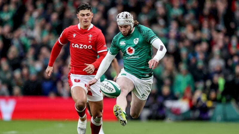 Ireland’s Mack Hansen with Louis Rees-Zammit of Wales. Photograph: Dan Sheridan/Inpho
