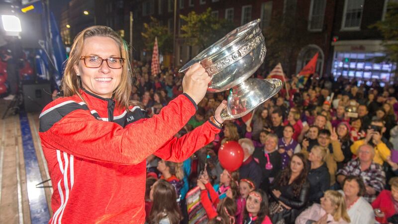 Team captain Aoife Murray holds aloft the All-Ireland trophy. Photograph: Michael MacSweeeney/Provision