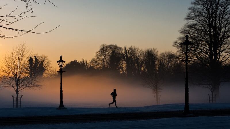 A runner in a misty Phoenix Park. Staying healthy and active will be crucial during these times. Photograph: iStock