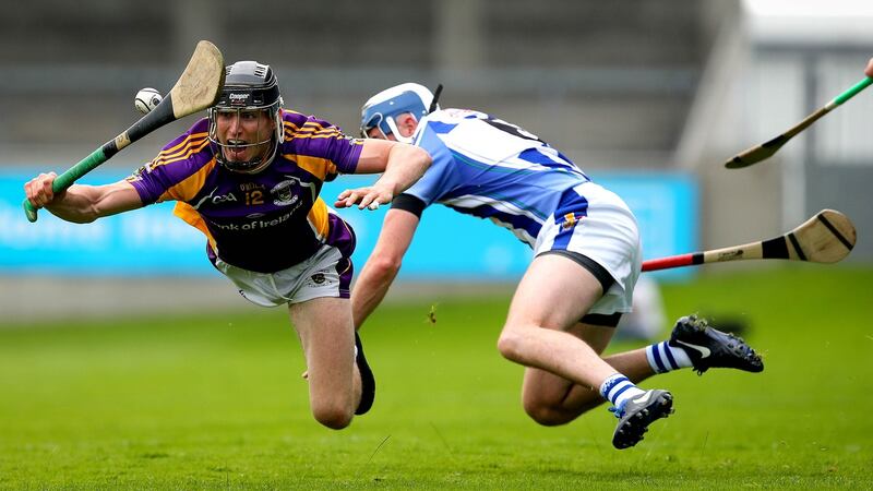 Ballyboden St Enda’s Simon Lambert and Caolan Conway of Kilmacud Crokes contest a loose ball. Photograph: Ryan Byrne/Inpho