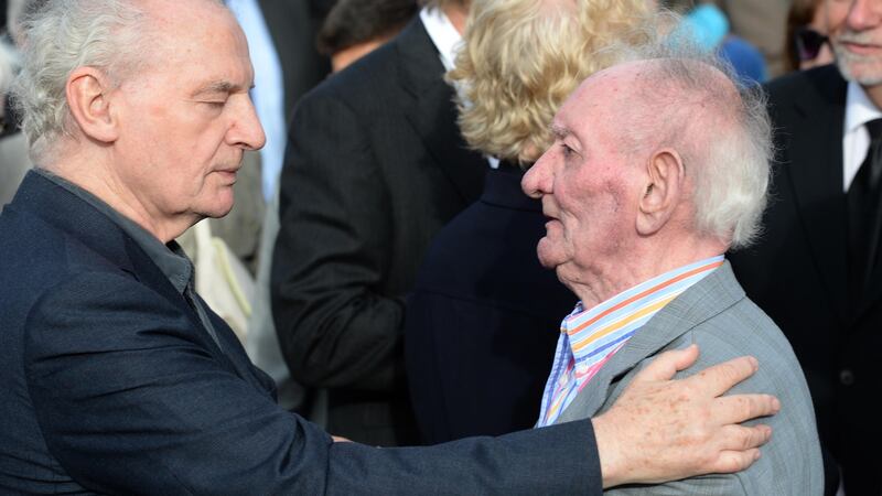 Seamus Deane and Brian Friel at the burial of Seamus Heaney, in Bellaghy, Co Derry in 2013. Photograph: Dara Mac Dónaill