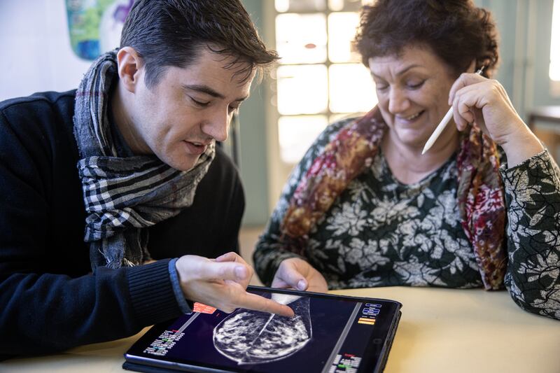 Peter Kecskemethy, a founder of Kheiron Medical Technologies, and his mother, Dr. Edith Karpati, who was a radiologist, in Budapest, Feb. 21, 2023. Hungary has become a major testing ground for AI software to spot cancer, as doctors debate whether the technology will replace them in medical jobs. (Akos Stiller/The New York Times)