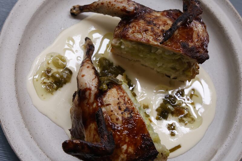 Quail at Comet: glistening with confit garlic and honey