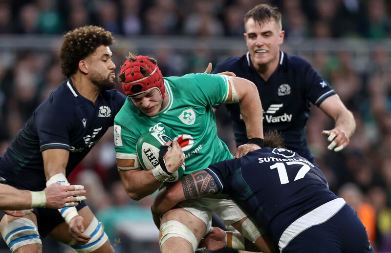 Ireland’s Josh van der Flier is tackled by Andy Christie and Rory Sutherland of Scotland during the Six Nations game at the Aviva Stadium. Photograph: Ben Brady/Inpho 