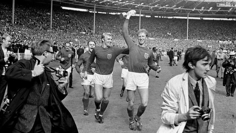 Jack Charlton holds the Jules Rimet trophy aloft after winning the World Cup in 1966. Photo: Martin Rickett/PA Wire