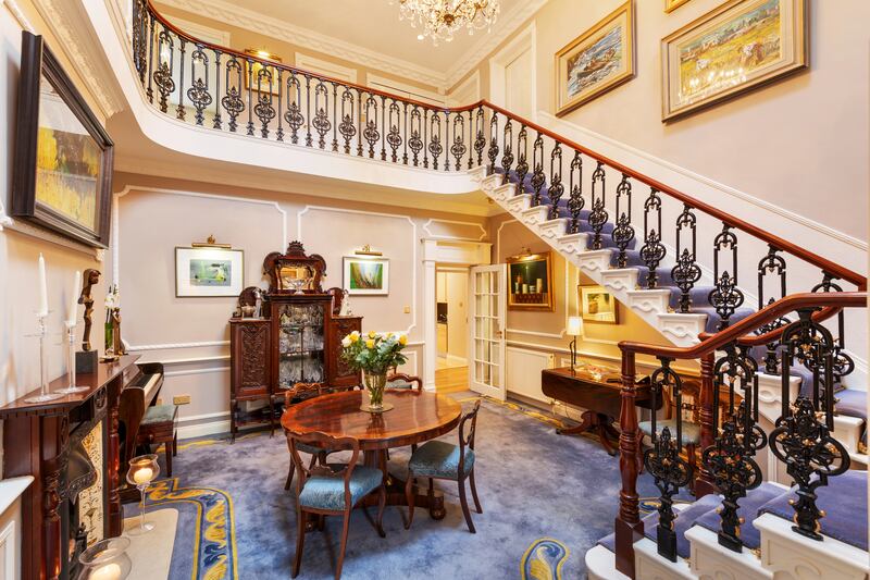 The property's most striking feature is a triple-height inner reception hall off the oak-floored front hall.
