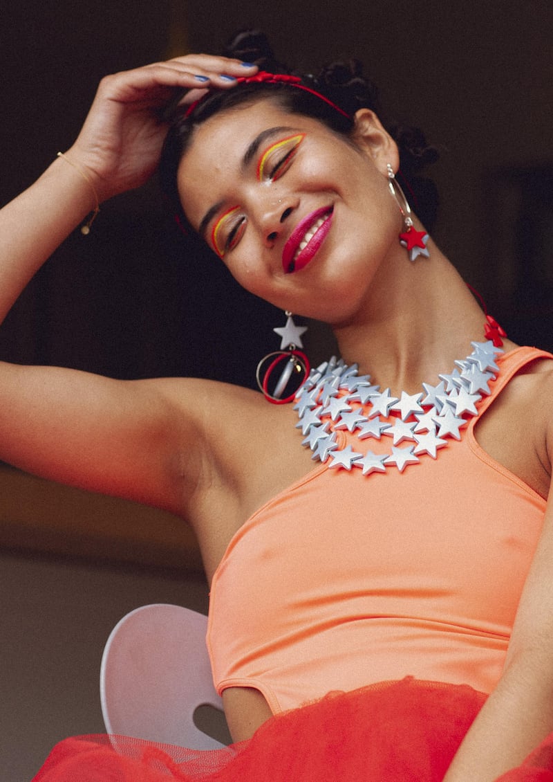 Collar €255, ear-ring hoops €55, full earring €145, red headband €55