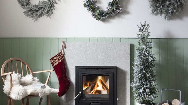 The flames of a real fire can now be housed behind the glass front of a multi-fuel-burning stove like the smart Arada design.