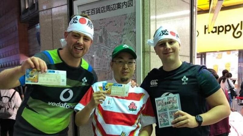Irish and Japanese rugby fans swap tickets. Photograph via the Irish Rugby World Cup Japan Forum Facebook page