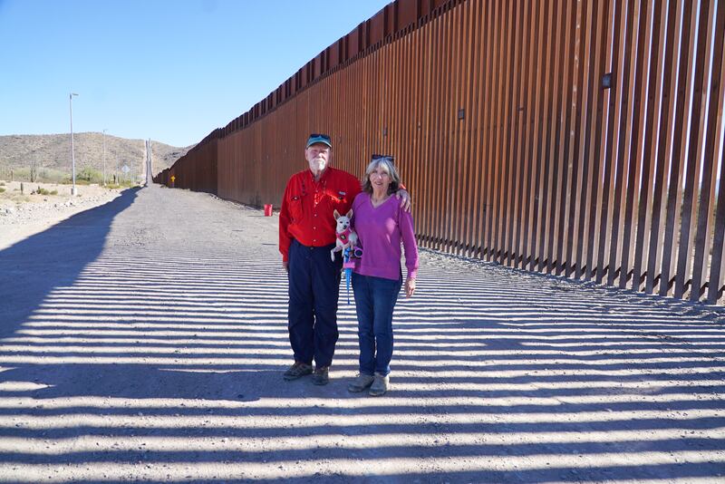 Tom and Carol Wingo and their dog Daisy at the the US/Mexico border wall. Photograph: Enda O'Dowd