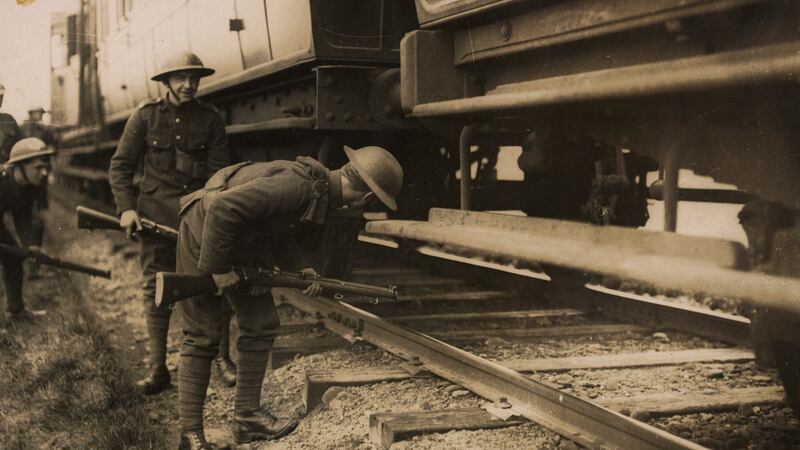 British soldiers of the Loyal North Lancashire Regiment search a train in Co Kerry. Photograph courtesy of the National Library of Ireland