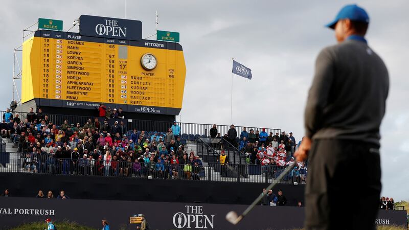Golf - The 148th Open Championship - Royal Portrush Golf Club, Portrush, Northern Ireland - July 18, 2019  General view of the scoreboard as Tiger Woods of the U.S. looks on during the first round  REUTERS/Paul Childs